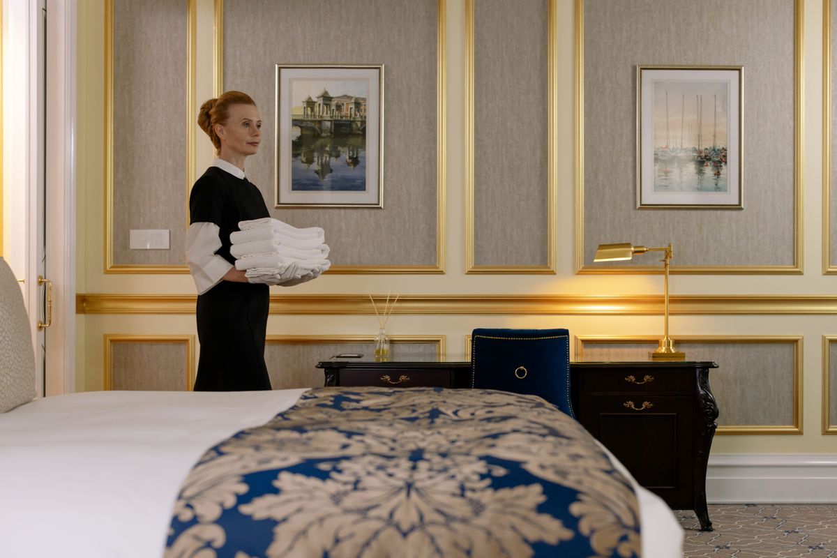 PristineX housekeeper carrying freshly laundered towels